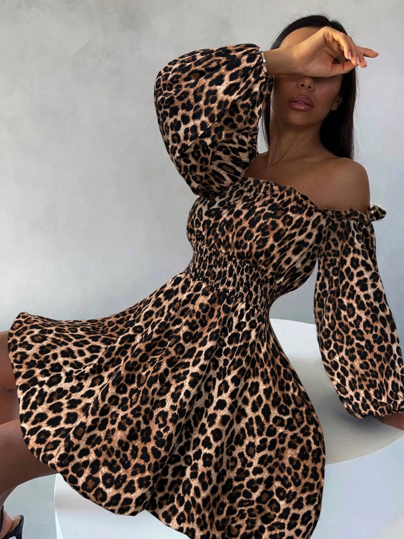 Embrace your wild side with this show-stopping bohemian leopard print dress! Featuring a flirty off-shoulder neckline and delicate ruffle trim, it's the perfect blend of effortless style and playful sophistication. Whether you're lounging by the ocean or turning heads around town, this versatile piece transitions seamlessly from beach days to everyday adventures. The relaxed fit and breathable fabric keep you comfortable and chic, while the bold leopard pattern adds that coveted boho-luxe vibe. Pack it, wea