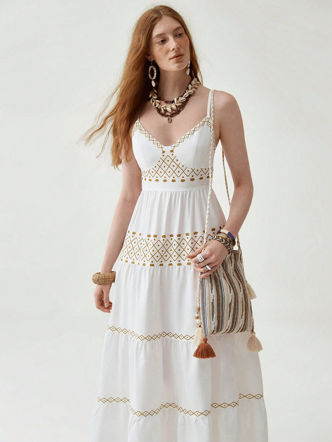 Embrace your free spirit in this whimsical Bohemian multi-layered dress! A patchwork of floral patterns dances across the fabric, creating a one-of-a-kind look that's sure to turn heads. Perfect for festival season, summer adventures, or whenever you want to add a splash of boho-chic fun to your wardrobe. Who said making a fashion statement couldn't be comfortable too?