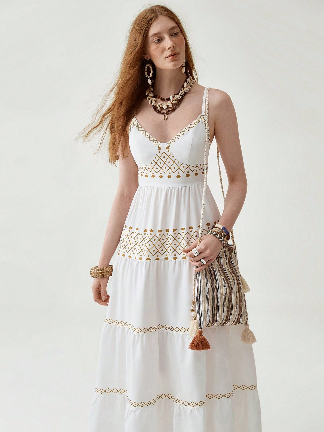 Embrace your free spirit in this whimsical Bohemian multi-layered dress! A patchwork of floral patterns dances across the fabric, creating a one-of-a-kind look that's sure to turn heads. Perfect for festival season, summer adventures, or whenever you want to add a splash of boho-chic fun to your wardrobe. Who said making a fashion statement couldn't be comfortable too?