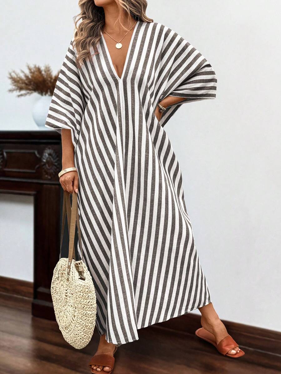 Embrace effortless coastal vibes in this breezy linen beach dress that's as comfortable as it is chic. Featuring relaxed striped detailing and long sleeves for sun protection, this plus-size beauty transitions seamlessly from beach days to seaside dinners. The flowing silhouette flatters every curve while the breathable linen keeps you cool when temperatures rise. Whether you're lounging by the water or strolling through a beachside market, this bohemian essential delivers that carefree, sun-kissed style yo