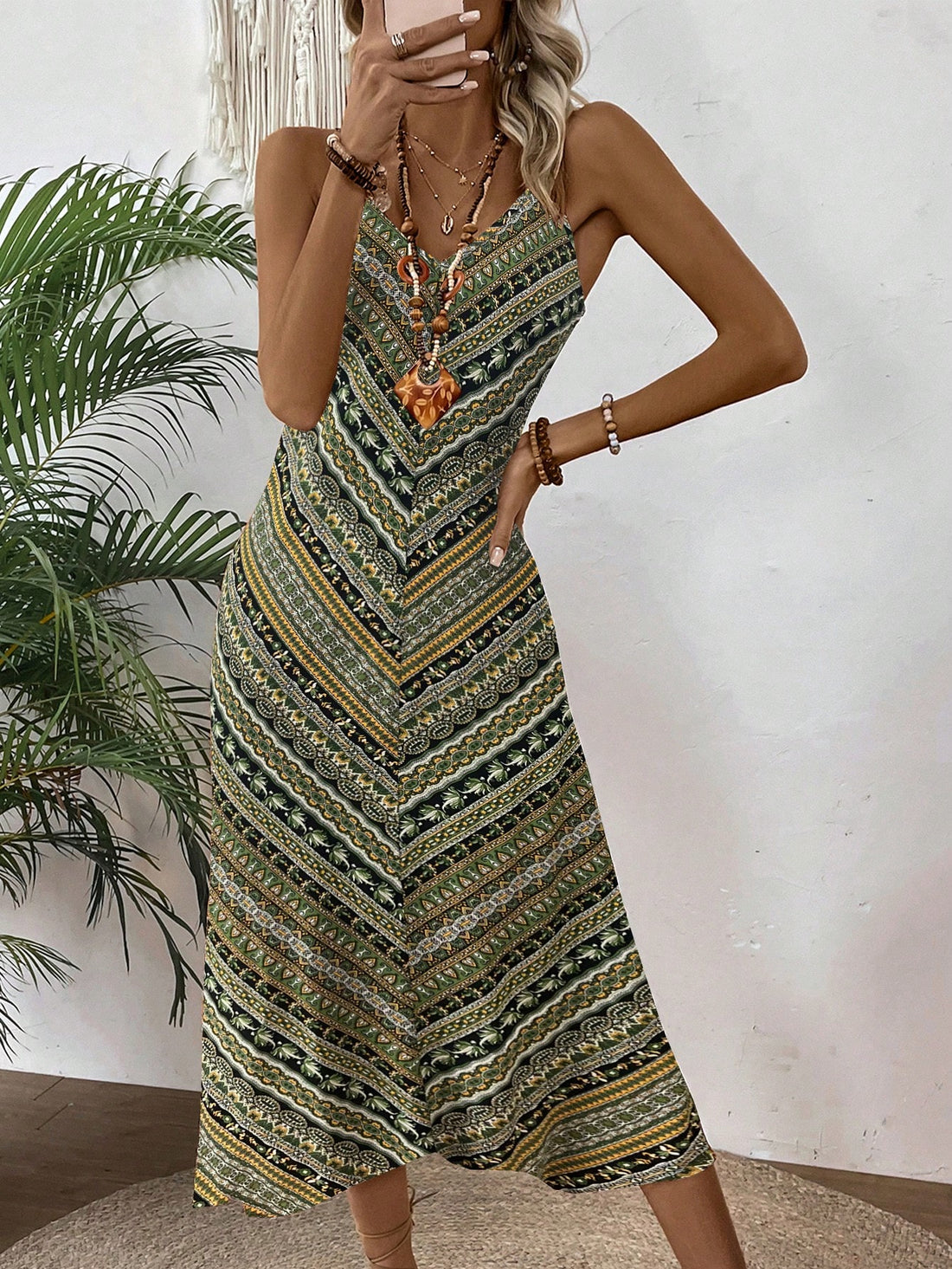Embrace sunny days in this playful Bohemian V-Neck Cami Dress, adorned with a lively floral print that dances with every step. Its breezy silhouette and delicate straps keep you cool and carefree, perfect for effortless summer adventures or casual brunches with friends. Let your style bloom with this easygoing dress that’s as fun as your summer plans!