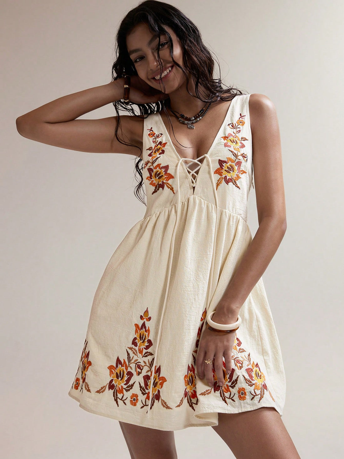 Step into sunshine with this Boho-Chic Apricot Embroidered Mini Dress, perfect for your next summer escape. Light and breezy, its delicate embroidery adds a touch of whimsy, while the flattering mini length keeps things flirty and fun. Whether you're strolling the beach or dancing at a festival, this dress brings effortless style and playful charm to every moment.