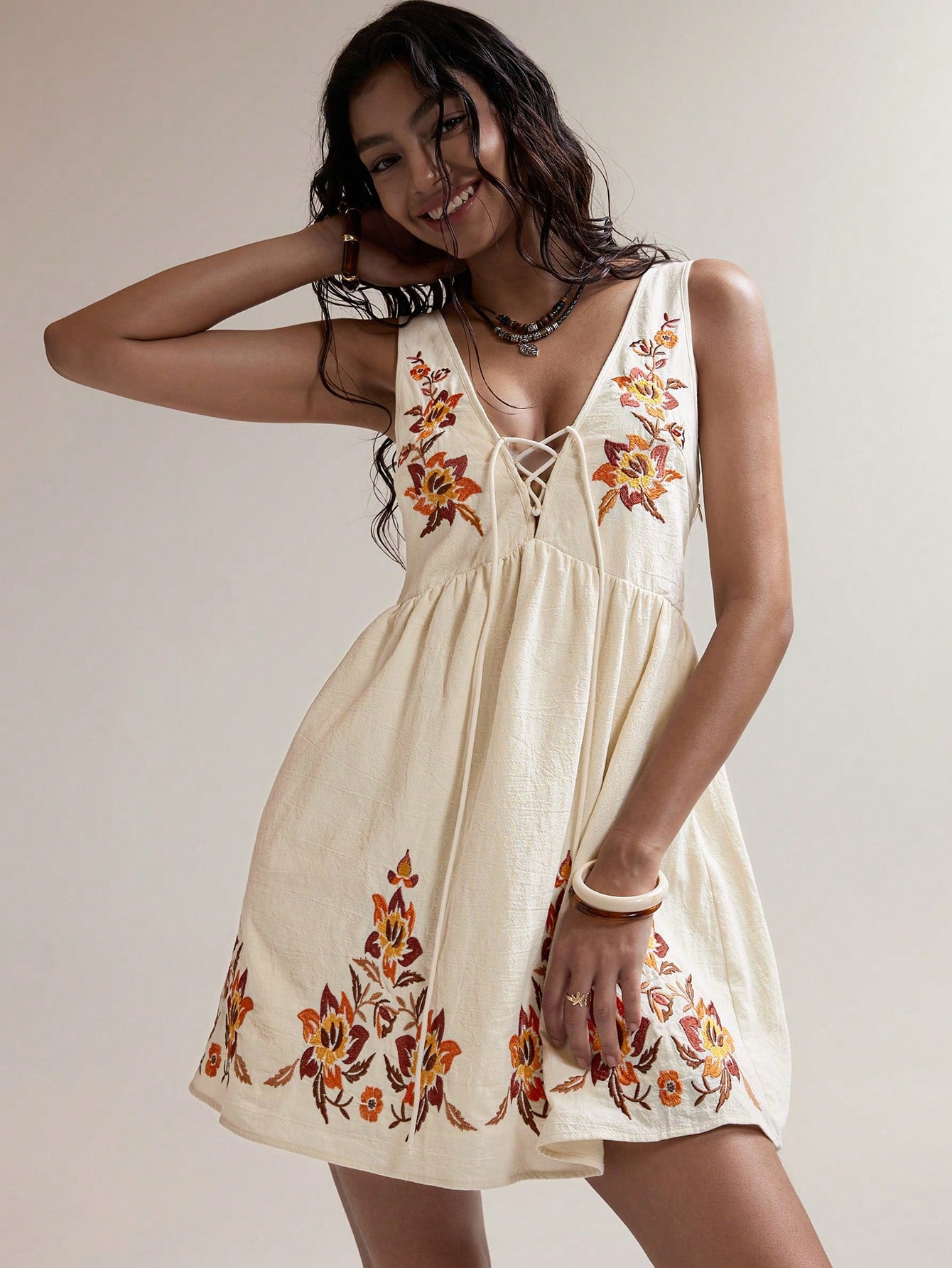 Step into sunshine with this Boho-Chic Apricot Embroidered Mini Dress, perfect for your next summer escape. Light and breezy, its delicate embroidery adds a touch of whimsy, while the flattering mini length keeps things flirty and fun. Whether you're strolling the beach or dancing at a festival, this dress brings effortless style and playful charm to every moment.