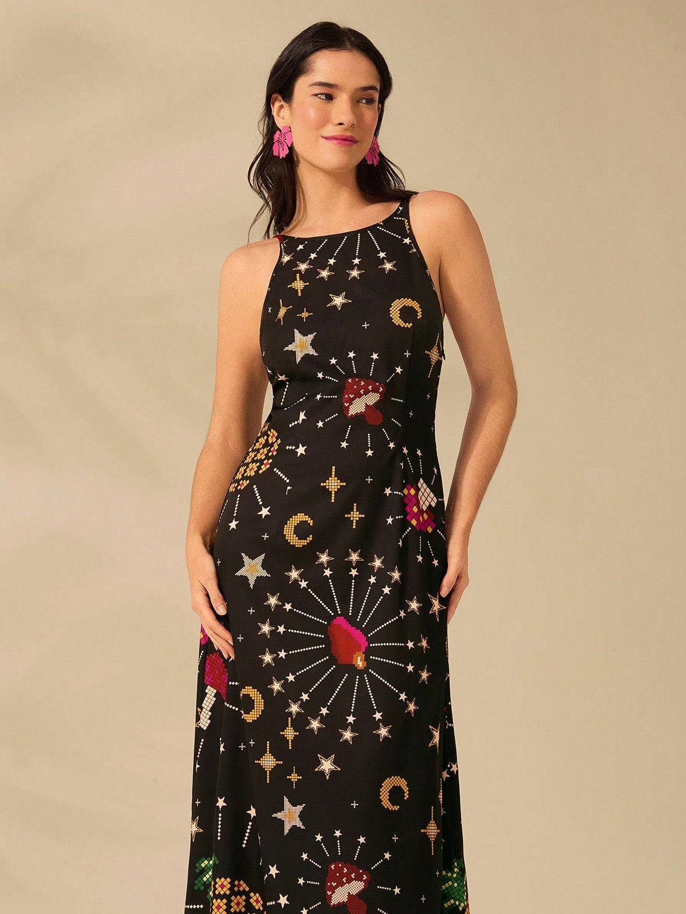 Unleash your inner bohemian with our Boho Bliss dress. Featuring a trendy black long design adorned with star, moon, and mushroom prints, this sleeveless dress is perfect for summer getaways. Embrace the carefree spirit and style of the boho lifestyle in this must-have piece.