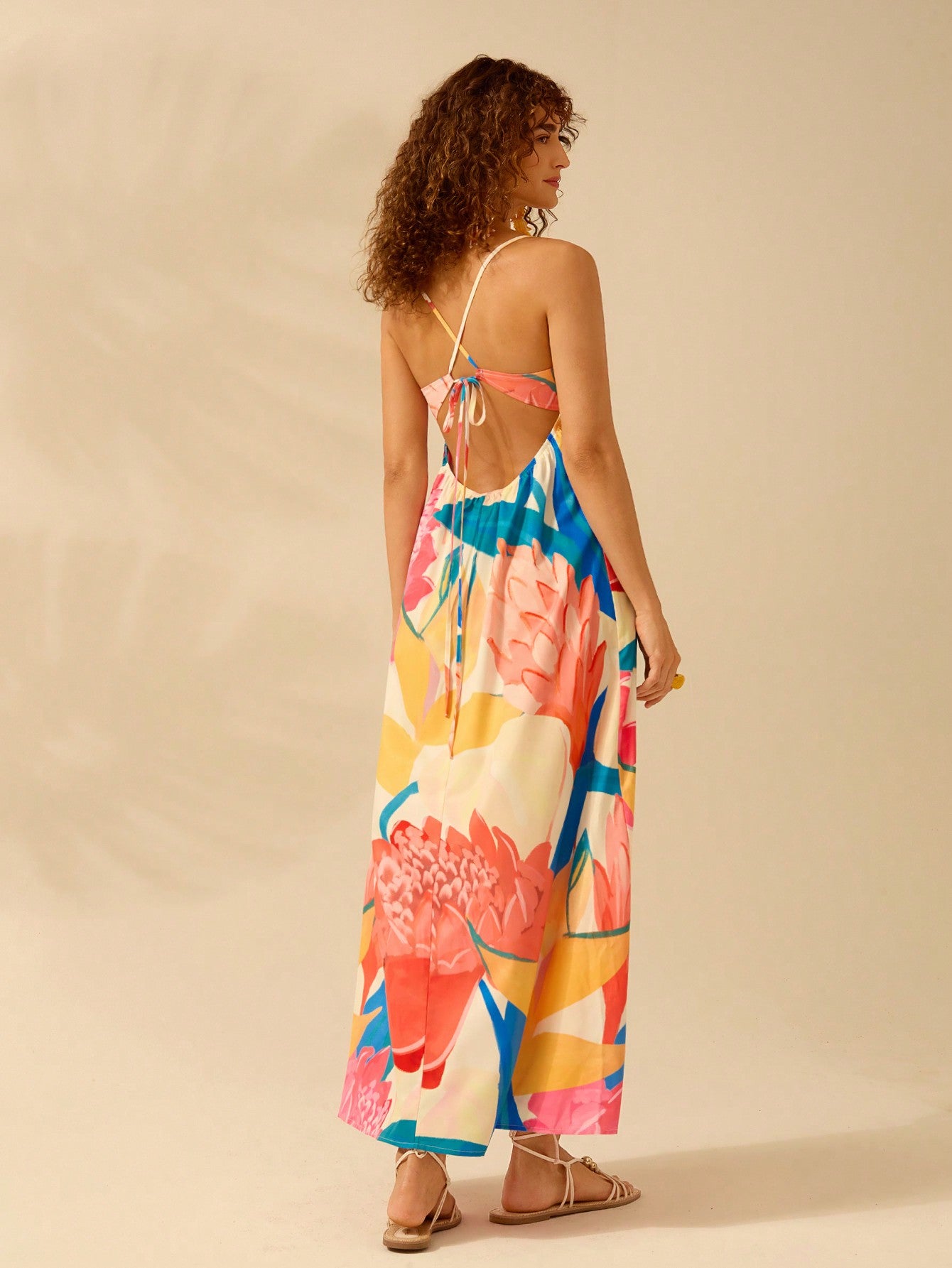 Effortlessly embrace summer style with our Boho Chic dress! Featuring a colorful tropical plant print and a sleeveless sling design, this dress is perfect for any sunny day. Say goodbye to the stress of putting together an outfit and hello to easy, breezy fashion!