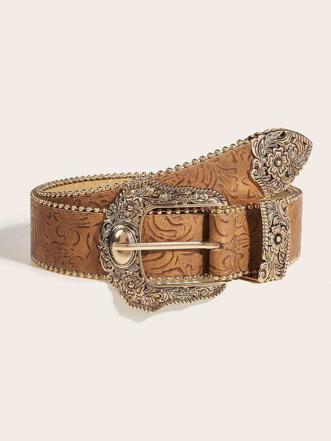 This Boho Chic Floral Geo Buckle Western Belt is the perfect addition to your wardrobe. With its unique floral design and stylish geo buckle, it is sure to elevate any outfit. Made for both stylish jeans and for Halloween fun, it offers versatility and statement-making flair.