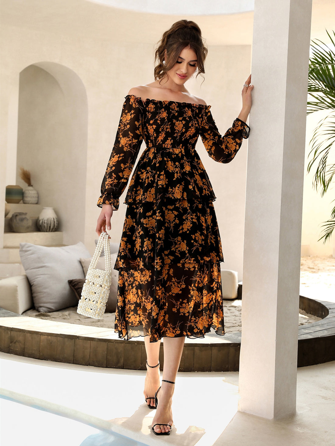 Unleash your inner bohemian with this stunning floral off-shoulder maxi dress. The flounce sleeves add a touch of whimsy to the chic design. Perfect for any occasion, this dress will have you feeling effortlessly stylish and confident. (No boring floral arrangements here, just a chic and flirty look!)