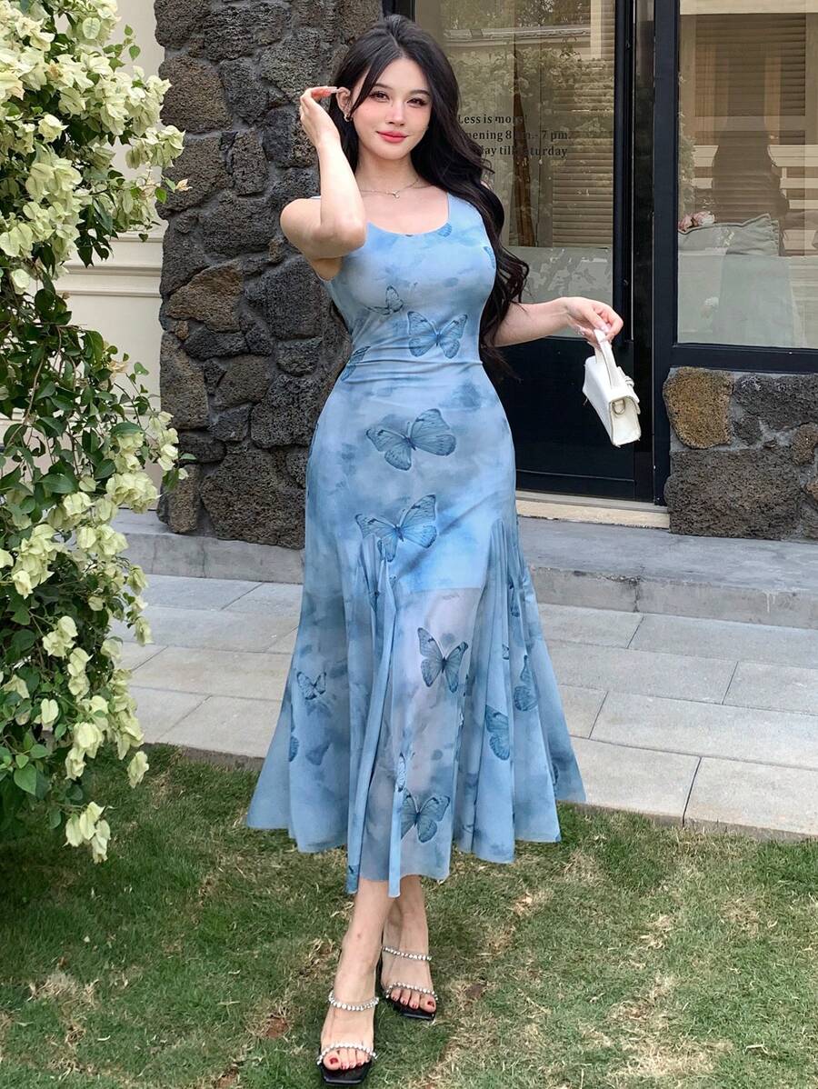 Step into sunny days with this Boho Chic Mid-Calf Floral Print Sleeveless Ruffle Dress. Its playful ruffles and breezy sleeveless design keep you cool and stylish, perfect for effortless summer adventures. The charming floral print adds a touch of whimsy, making every moment feel like a carefree celebration.