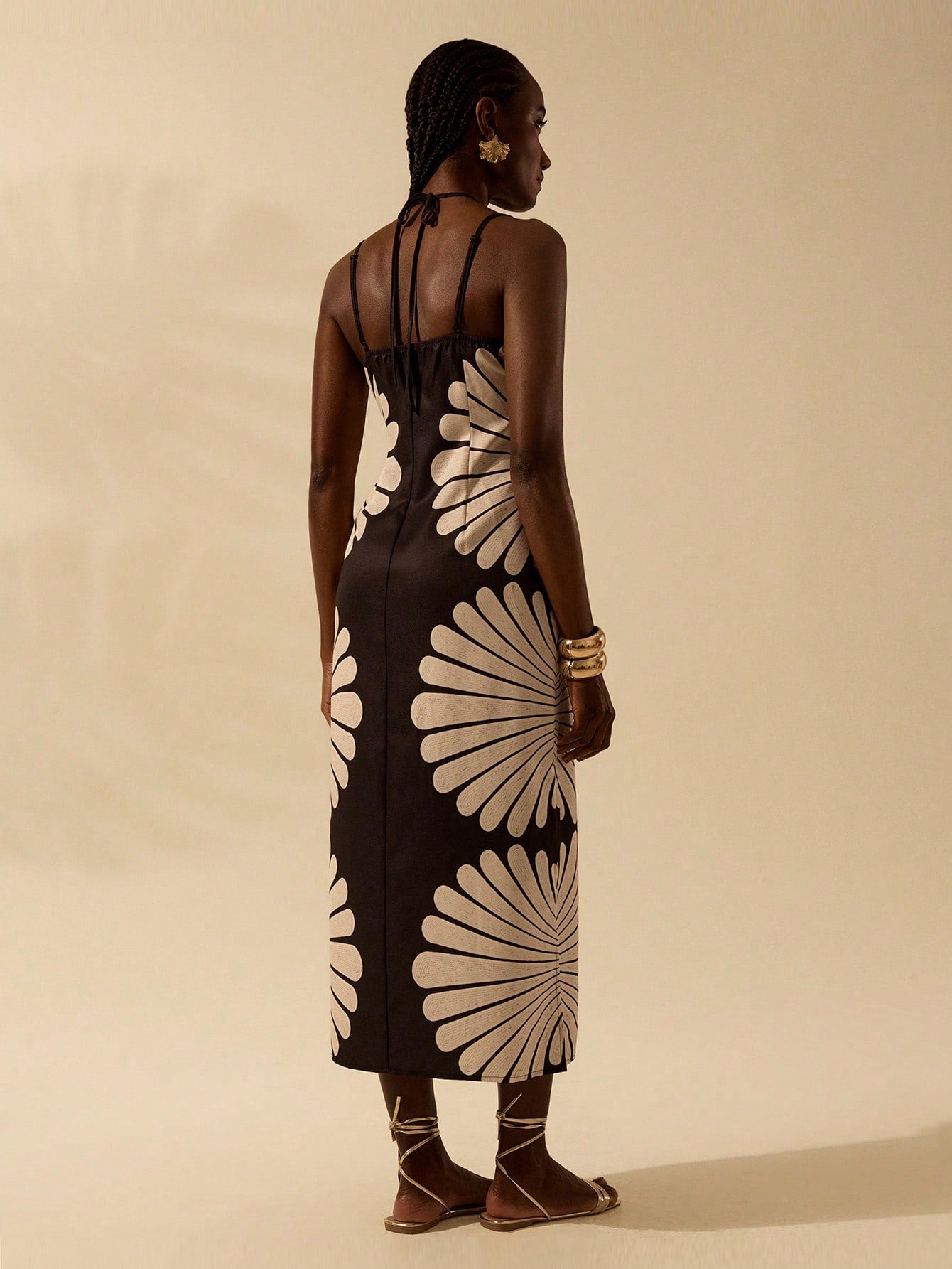 Get ready to rock the beach in this Boho Chic Shell Print Dress that exudes effortless summer style. With its delicate spaghetti straps and playful shell print, you'll be the epitome of bohemian beauty. Perfect for soaking up the sun and sipping on a margarita. (Sunglasses and beachy waves not included!)