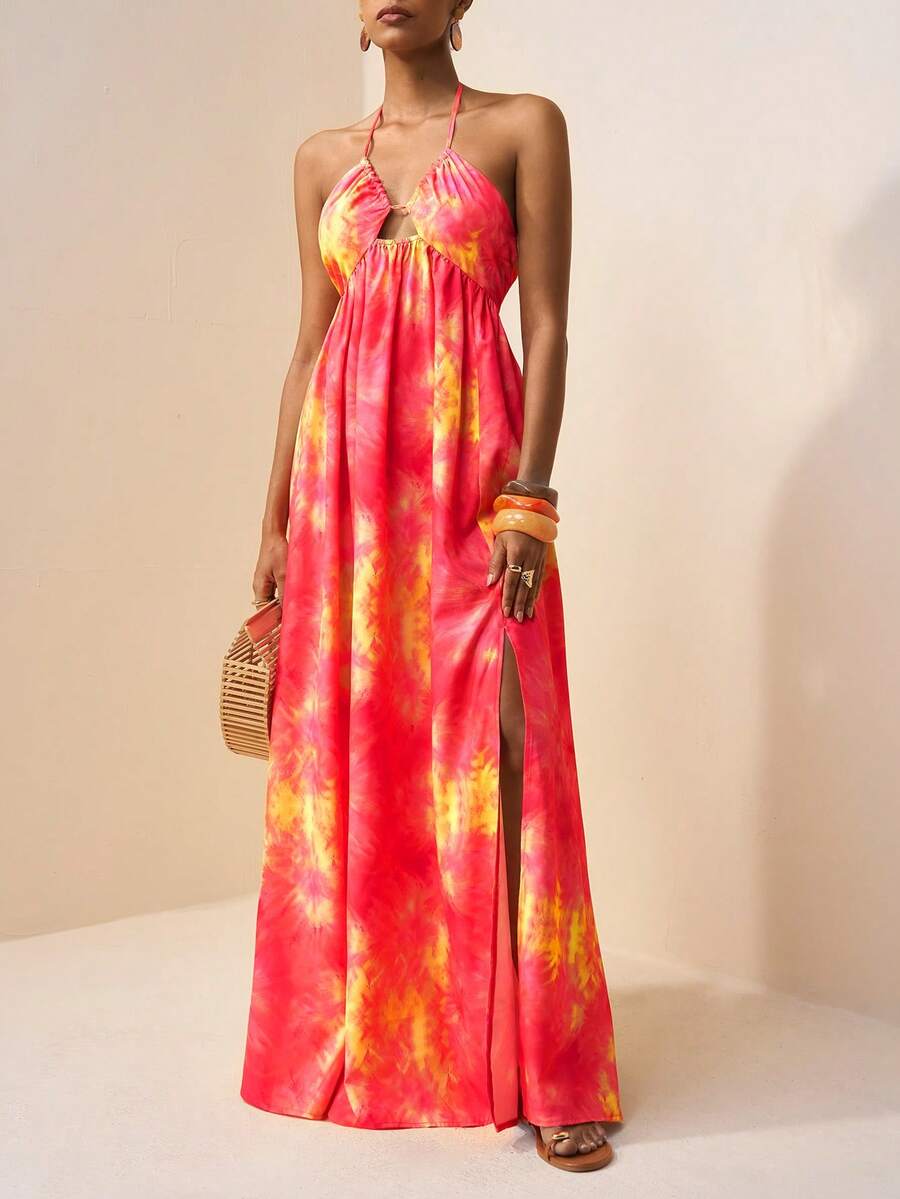 Embrace effortless bohemian style with this stunning tie-dye floral maxi dress. Featuring delicate spaghetti straps, a flattering high waist, and a daring backless design with thigh split, this piece transitions seamlessly from festival grounds to beach getaways. The semi-sheer woven fabric in soft pink tones drapes beautifully in a flared silhouette, while the slim fit keeps you feeling confident and comfortable. Perfect for creating those carefree, wanderlust-inspired looks all season long.