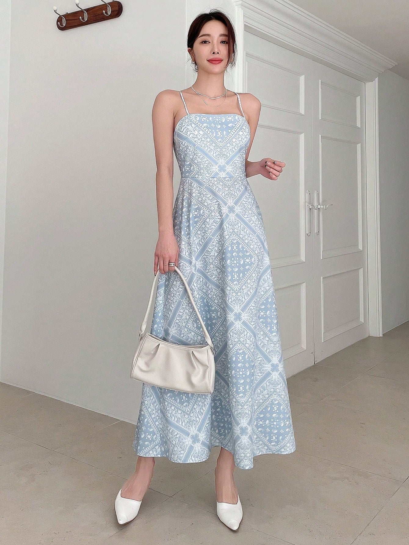 Unleash your inner bohemian with this playful paisley print backless cami dress. Perfect for a summer day out, the tie straps add a touch of detail while keeping the dress in place. Embrace your free-spirited style with this boho chic dress. (No more boring summer outfits!)