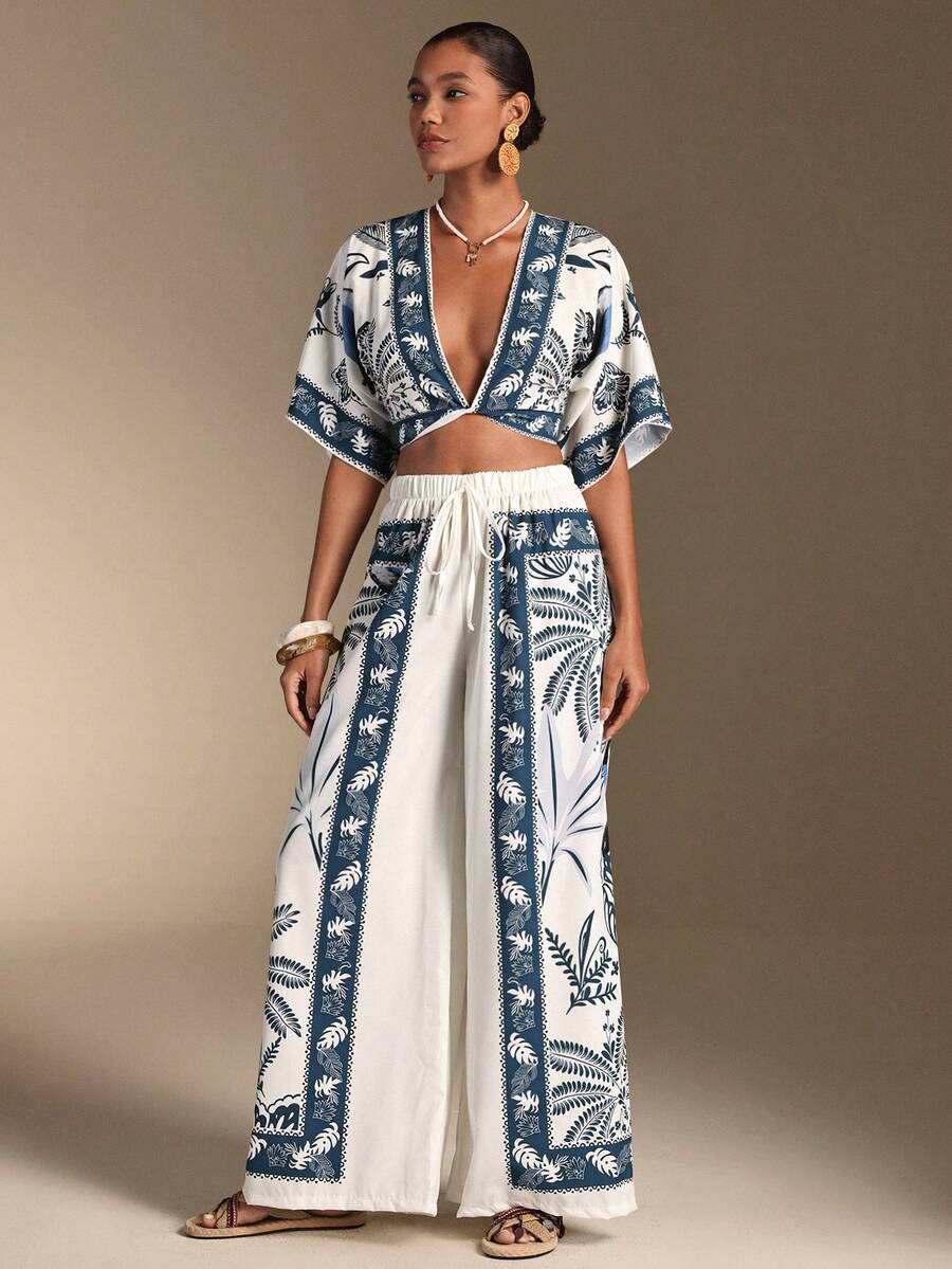 Embrace effortless elegance with our Boho Chic Swim Oasis 2-Piece Set. This stunning collection pairs a flowing kimono top with comfortable matching pants, creating the perfect vacation ensemble. The lightweight, breathable fabric keeps you cool and stylish whether you're lounging by the pool, strolling the beach, or enjoying sunset dinners. The relaxed silhouette flatters all body types while the bohemian design adds an artistic touch to your summer wardrobe.