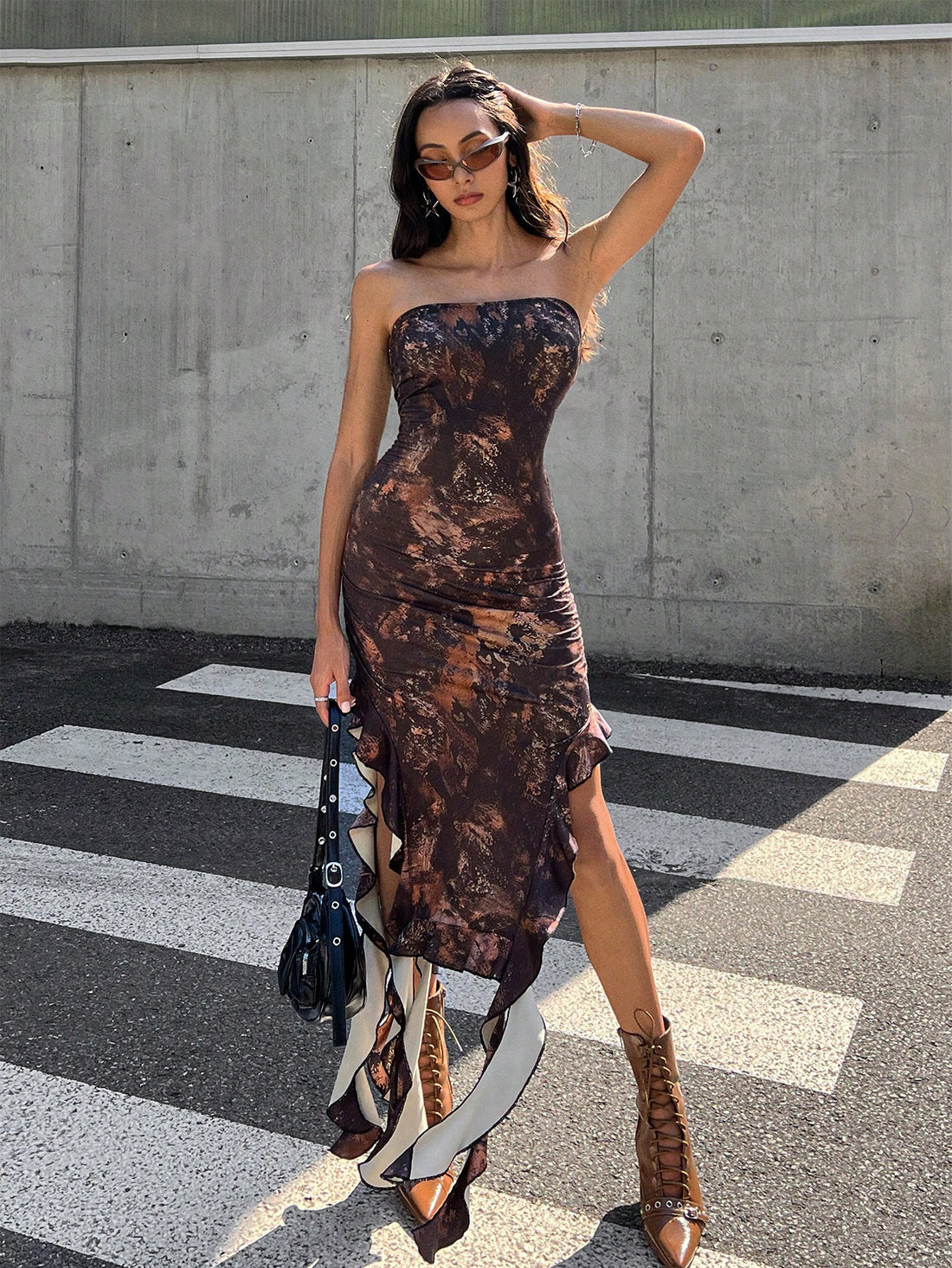 Step out in style with our Boho Chic Tie-Dye Asymmetrical Hem Tube Dress with Knot Detail! The unique tie-dye design adds a trendy touch while the asymmetrical hemline and knot detail create a flattering and playful silhouette. Perfect for any occasion, this dress will make you stand out with its bohemian charm.