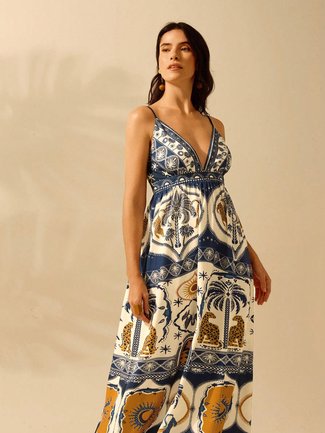 Unleash your wild side with our Boho Chic Tropical V-Neck Dress. Featuring a bold leopard and palm leaf print, this dress is perfect for your summer getaways. With its relaxed fit and stylish v-neck, you'll be turning heads wherever you go. Get ready to be the queen of the jungle!