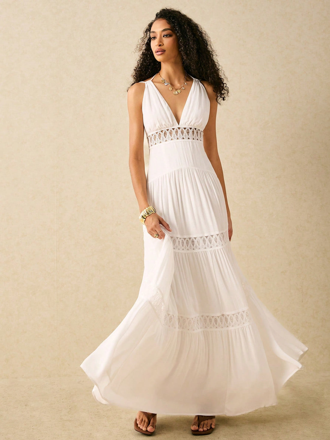 Channel your inner boho babe with our chic V-neck suspender dress adorned with a stunning hollow lace skirt. Perfect for your summer beach holidays, this dress effortlessly combines style and comfort for a carefree and playful look. Embrace your free spirit and rock this dress with confidence!