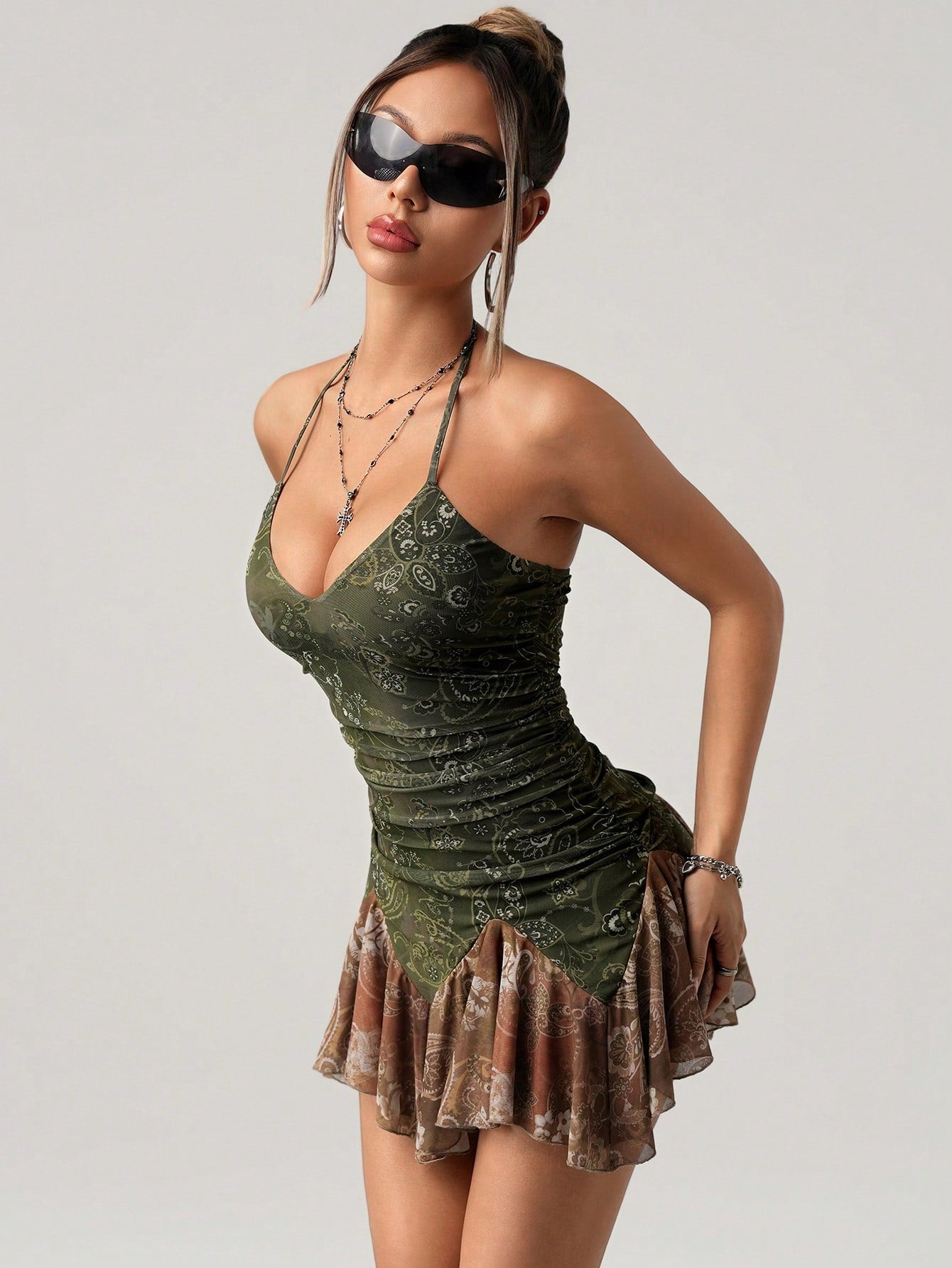 Get ready to turn heads in this Boho Chic Y2K Spring Dress! With its sexy halter style and eye-catching color block paisley print, you'll be the talk of any fashionable summer vacation. Perfect for flaunting your style and making a statement.