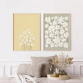 Boho daisy floral canvas diptych with white flowers and olive stems on warm pastel backgrounds