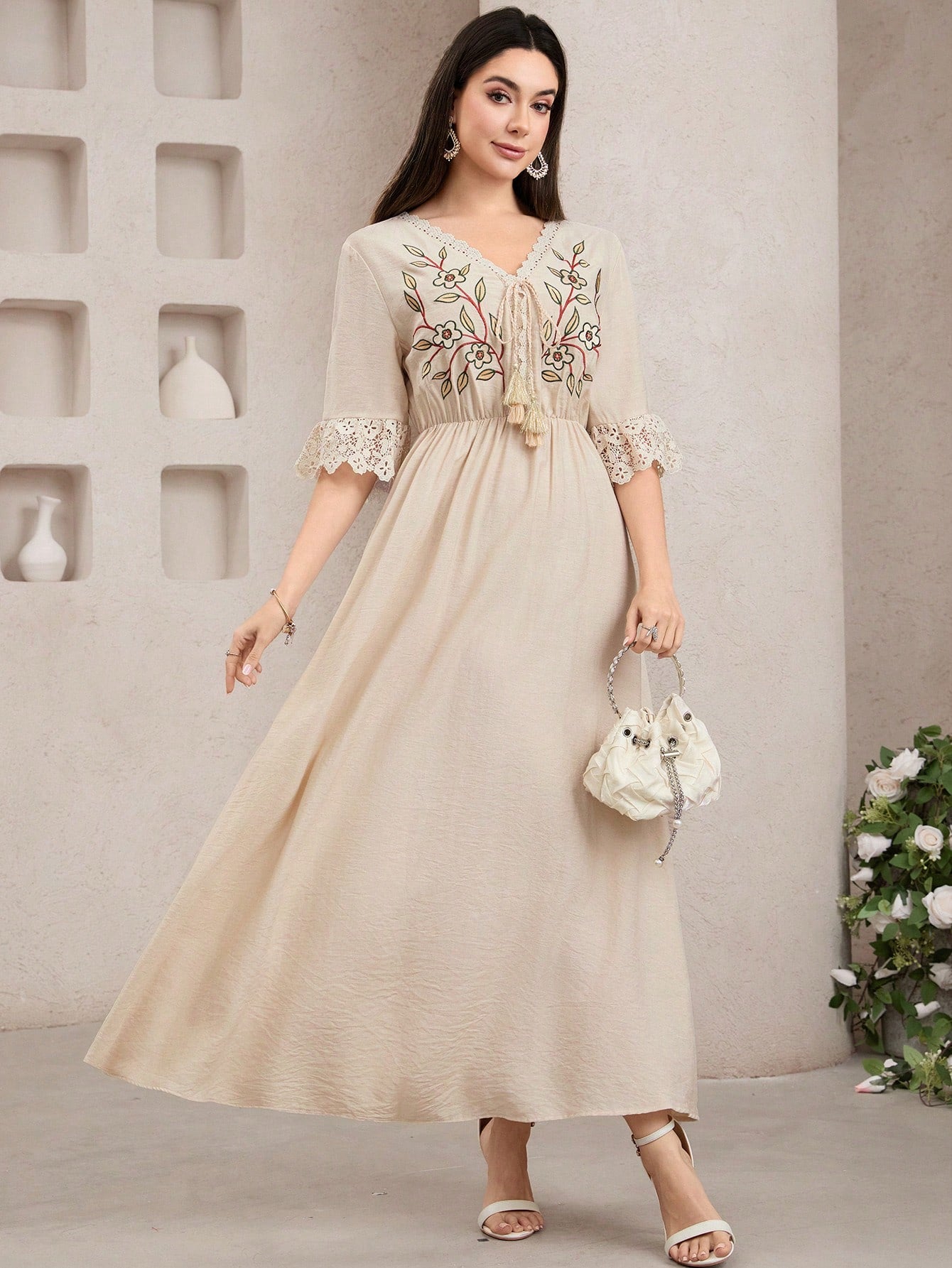 Twirl into summer with our Boho Floral Embroidery Long Dress! Delicate embroidered flowers dance across flowing fabric, while pretty lace trim adds that perfect touch of whimsy. This free-spirited maxi is your ticket to effortless style whether you're beach-hopping or sipping sunset cocktails on vacation. Embrace your inner flower child!