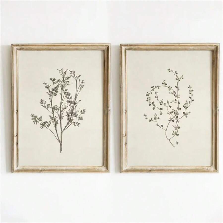 Front wall mockup of two ivory and charcoal botanical prints in distressed gold-tone frames