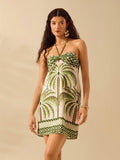 Get ready to soak up the sun in style with our Boho Tropical Coconut Tree Print Halter Dress. With its vibrant and playful print, this dress is the perfect addition to your summer beach wardrobe. The halter design is not only on-trend, but also comfortable and flattering. Don't miss out, this dress is a must-have for all your summer beach days!