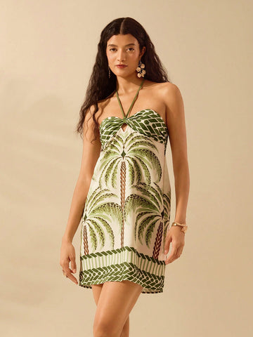 Get ready to soak up the sun in style with our Boho Tropical Coconut Tree Print Halter Dress. With its vibrant and playful print, this dress is the perfect addition to your summer beach wardrobe. The halter design is not only on-trend, but also comfortable and flattering. Don't miss out, this dress is a must-have for all your summer beach days!