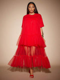 Twirl into festival season with this dreamy boho tulle maxi dress that's equal parts whimsical and effortlessly chic. Layered tiers create romantic movement with every step, while the flowing silhouette keeps you cool and comfortable under the summer sun. Perfect for music festivals, garden parties, or any occasion calling for bohemian vibes. Pair it with your favorite sandals and let your free spirit shine.
