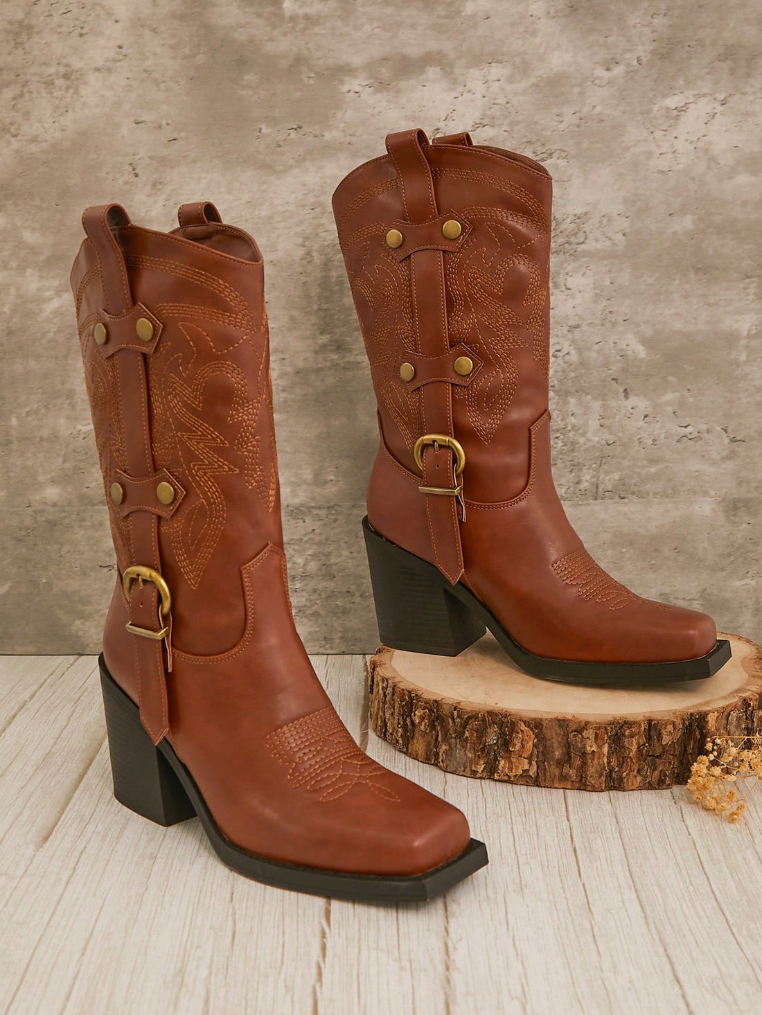 Step into style with these Bold Brown Square Toe Cowboy Boots designed just for women who love a little edge. Featuring a chunky platform and playful straps, these boots bring Western charm to your fall and winter wardrobe. Perfect for adding a confident kick to any outfit, they blend classic cowboy vibes with modern flair. Get ready to turn heads and stomp through the season in comfort and boldness!