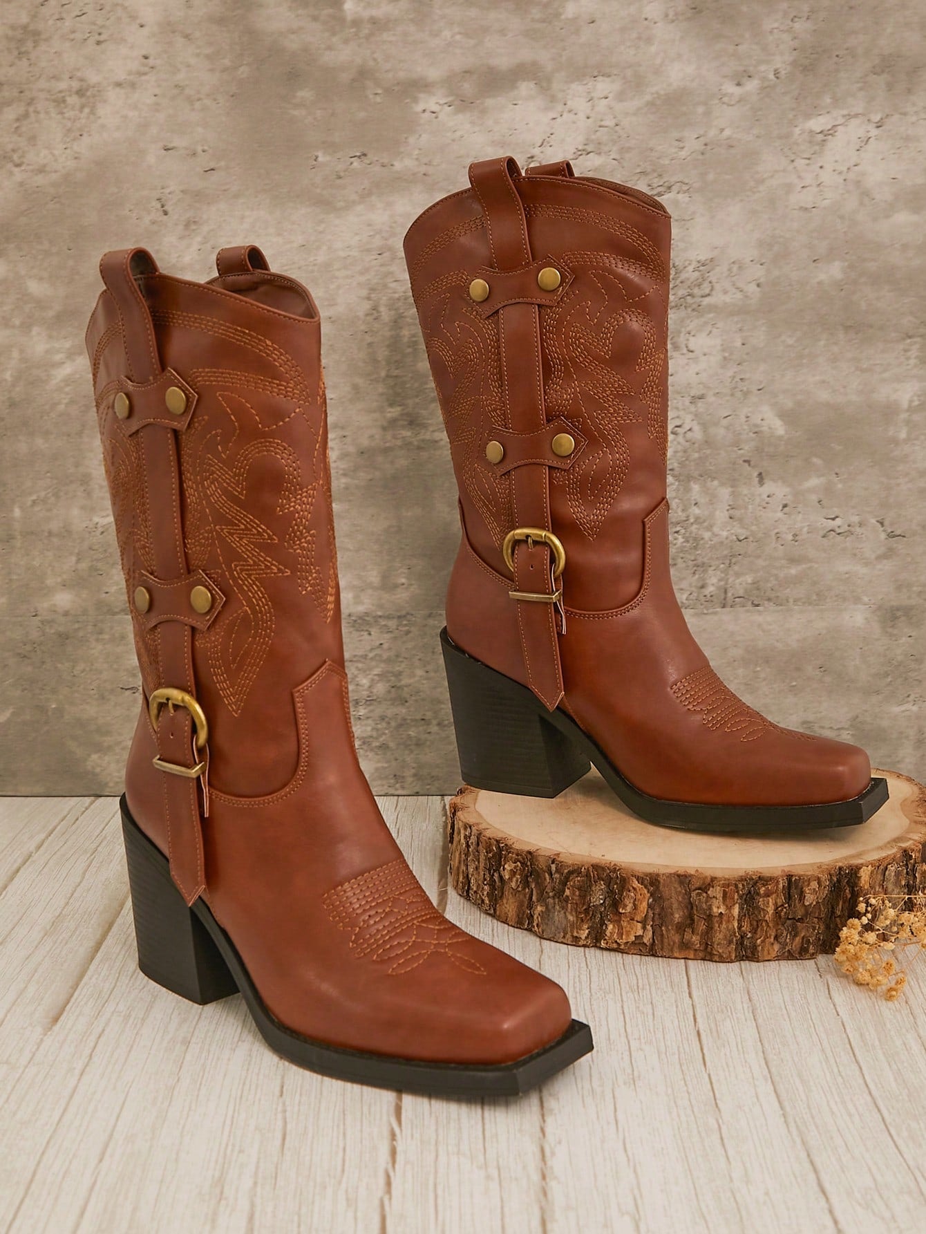 Step into style with these Bold Brown Square Toe Cowboy Boots designed just for women who love a little edge. Featuring a chunky platform and playful straps, these boots bring Western charm to your fall and winter wardrobe. Perfect for adding a confident kick to any outfit, they blend classic cowboy vibes with modern flair. Get ready to turn heads and stomp through the season in comfort and boldness!