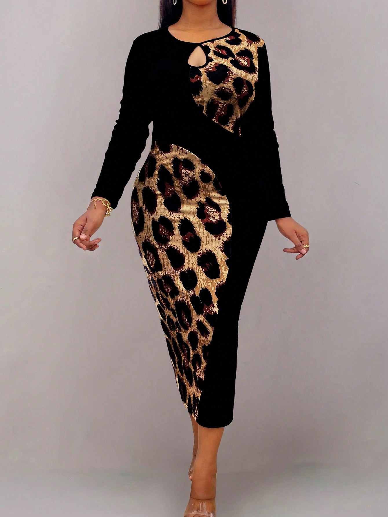 Introducing the Bold & Chic: Plus Size Leopard Print Keyhole Bodycon Dress. This stylish and trendy dress features a flattering bodycon silhouette and a bold leopard print design. With a keyhole neckline, this dress is perfect for making a statement and standing out from the crowd. Upgrade your wardrobe with this fierce and fashionable dress.