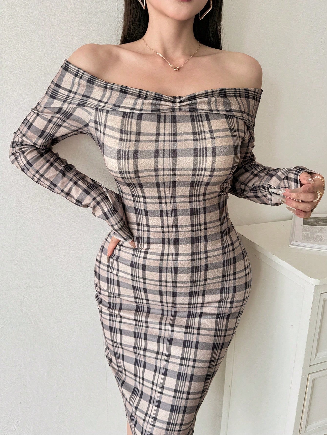 Unleash your bold and confident side with our Long Sleeve Fitted Off Shoulder Plaid Mini Dress! The statement sleeves add a playful touch to this daringly unique dress. Perfect for standing out in a sea of basic outfits, this dress will have you feeling fierce and fashionable.