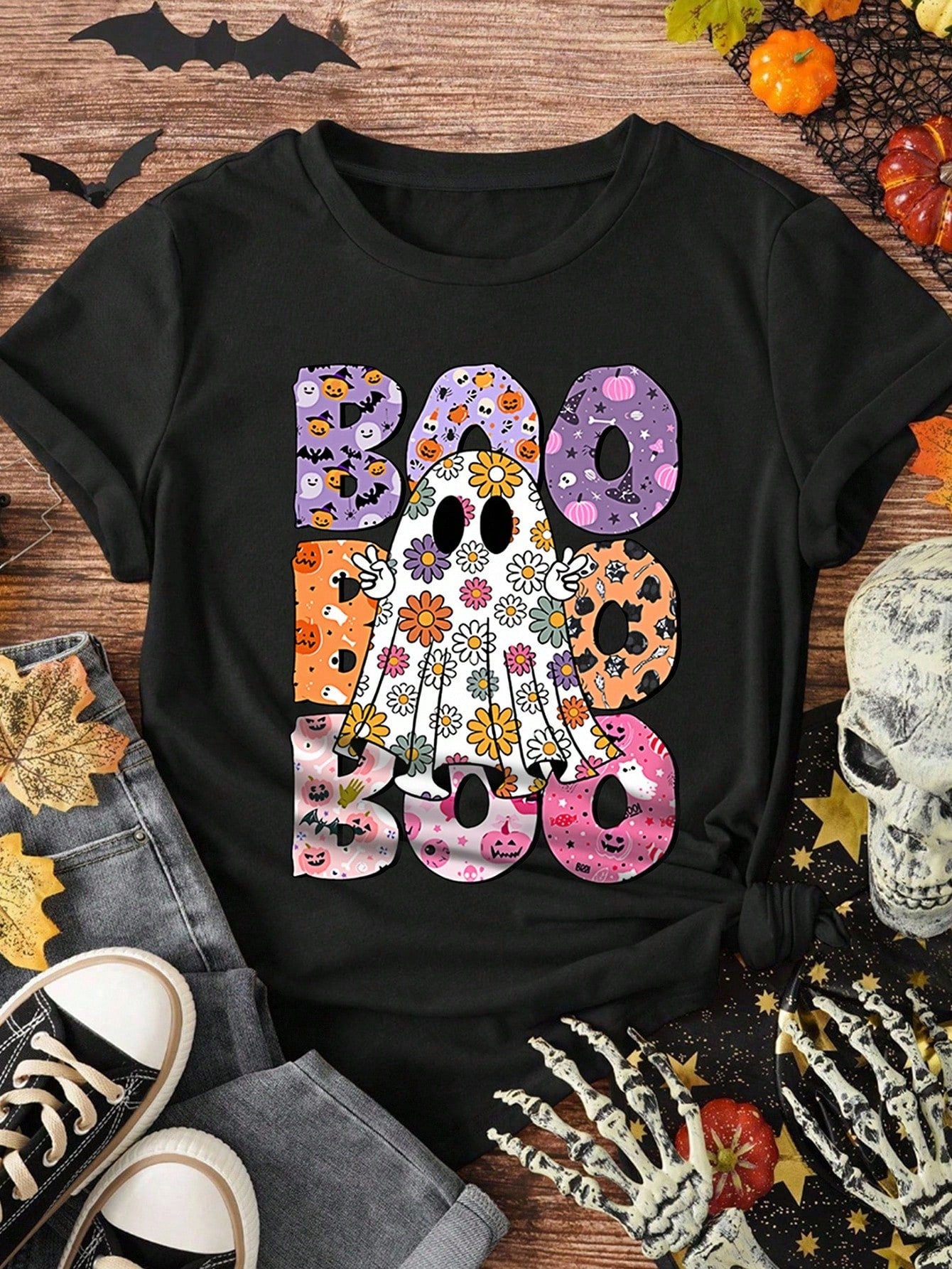 Celebrate Halloween in style with this Boo-tiful Floral Ghost Print Plus Size T-Shirt. Featuring a charming ghost surrounded by delicate floral designs, it blends spooky and sweet perfectly. Designed for comfort and confidence, this tee adds a playful touch to your festive wardrobe while flattering your curves. Embrace the season with a fun, stylish look that’s sure to turn heads at any Halloween gathering.