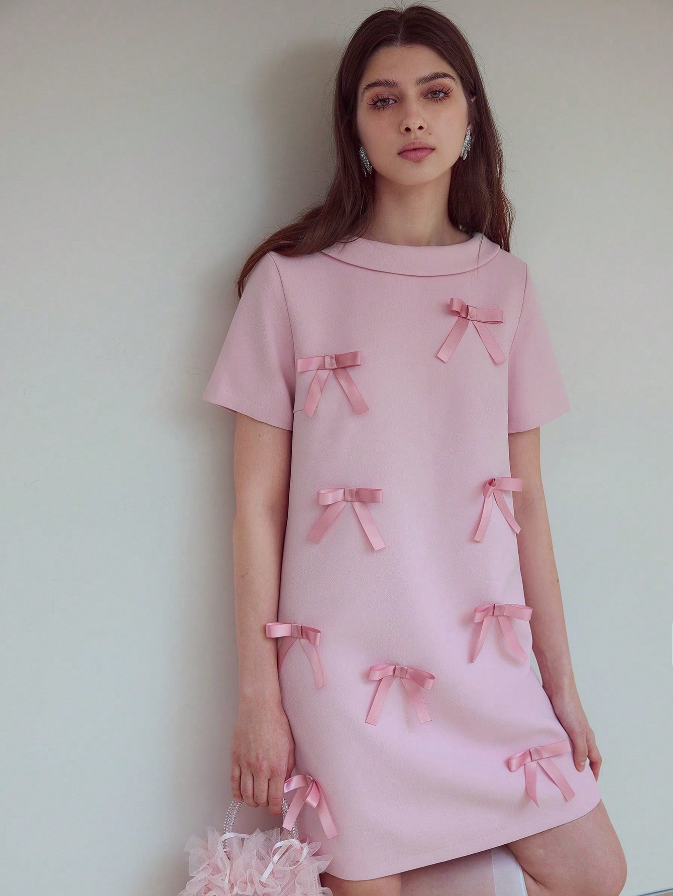 Step out in style with the Bow Decor Zipper Back Dress, where playful charm meets elegant design. Featuring a chic bow detail and a sleek zipper back, this dress adds a flirty twist to your wardrobe. Perfect for turning heads at any event, it combines comfort with a touch of sophistication for a look that’s both fun and fabulous.