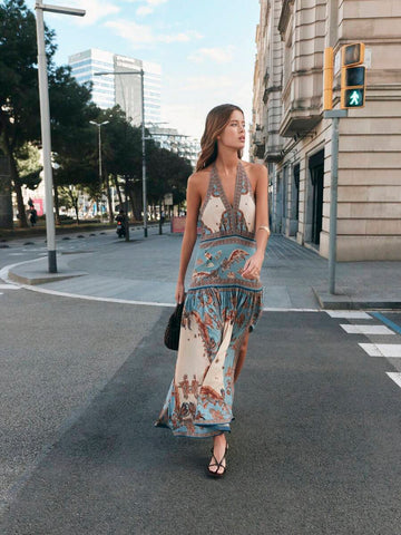 Capture the beauty of summer with this Breezy Light Blue and Beige Halter Neck Maxi Dress, designed to keep you cool, comfortable, and effortlessly elegant. Featuring a soft floral print, a flattering halter neckline, and a flowing maxi silhouette, this dress is the perfect choice for warm-weather adventures and special occasions.