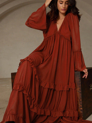 Step into fall with flair in this Brick Red Chiffon Dress! Featuring a daring deep V neckline, playful frill trim, and charming flare cuffs, it’s your new boho fave. Plus, the reversible design lets you switch up your look effortlessly, while the ruffled hem adds a flirty bounce with every step. Perfect for twirling through autumn days in style!