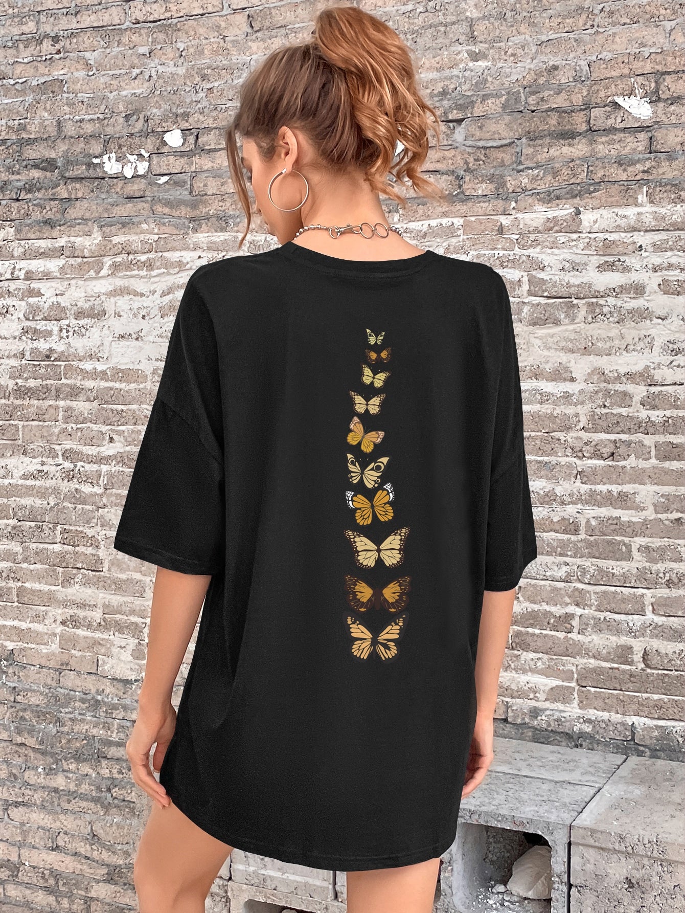Discover effortless style with our Butterfly Dreams Drop Shoulder Tee. Made with soft, lightweight material, this tee features a unique drop shoulder design and a whimsical butterfly print. Perfect for any occasion, this tee adds a touch of sophistication and comfort to your wardrobe.