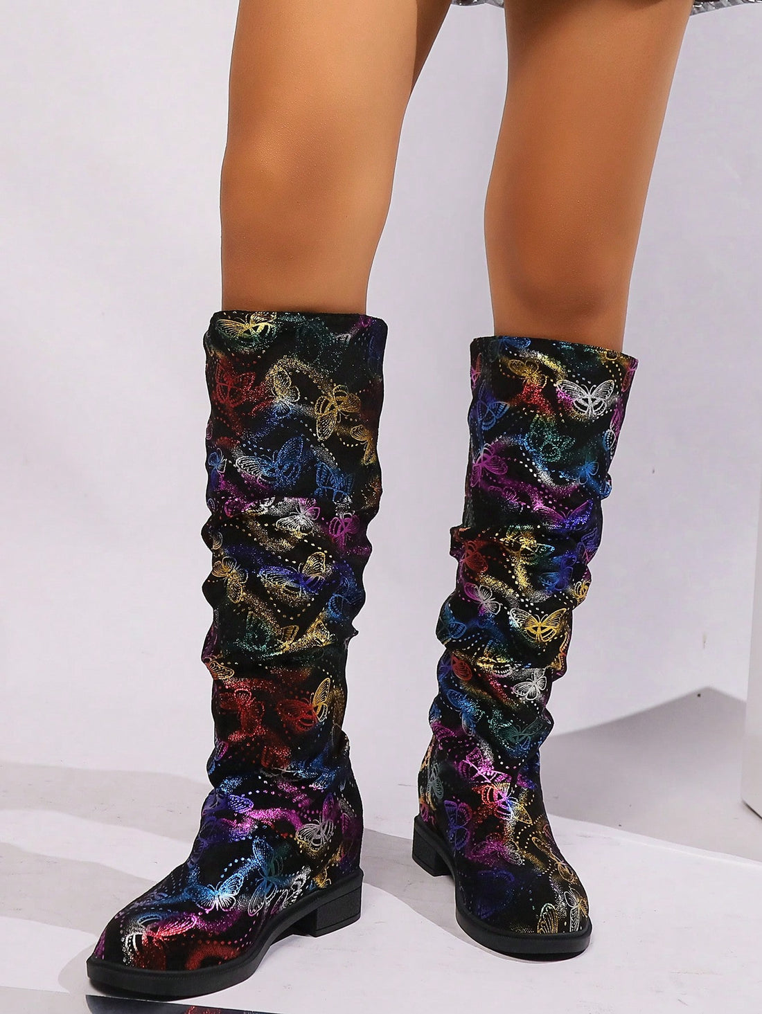 Experience ultimate comfort and style with Butterfly Dreams Mid-Calf Boots. Made from luxurious sheepskin texture, these boots are fashion-forward and cozy. Whether you're running errands or dressing up for a night out, these boots will keep your feet warm and chic. Transform your wardrobe with Butterfly Dreams.