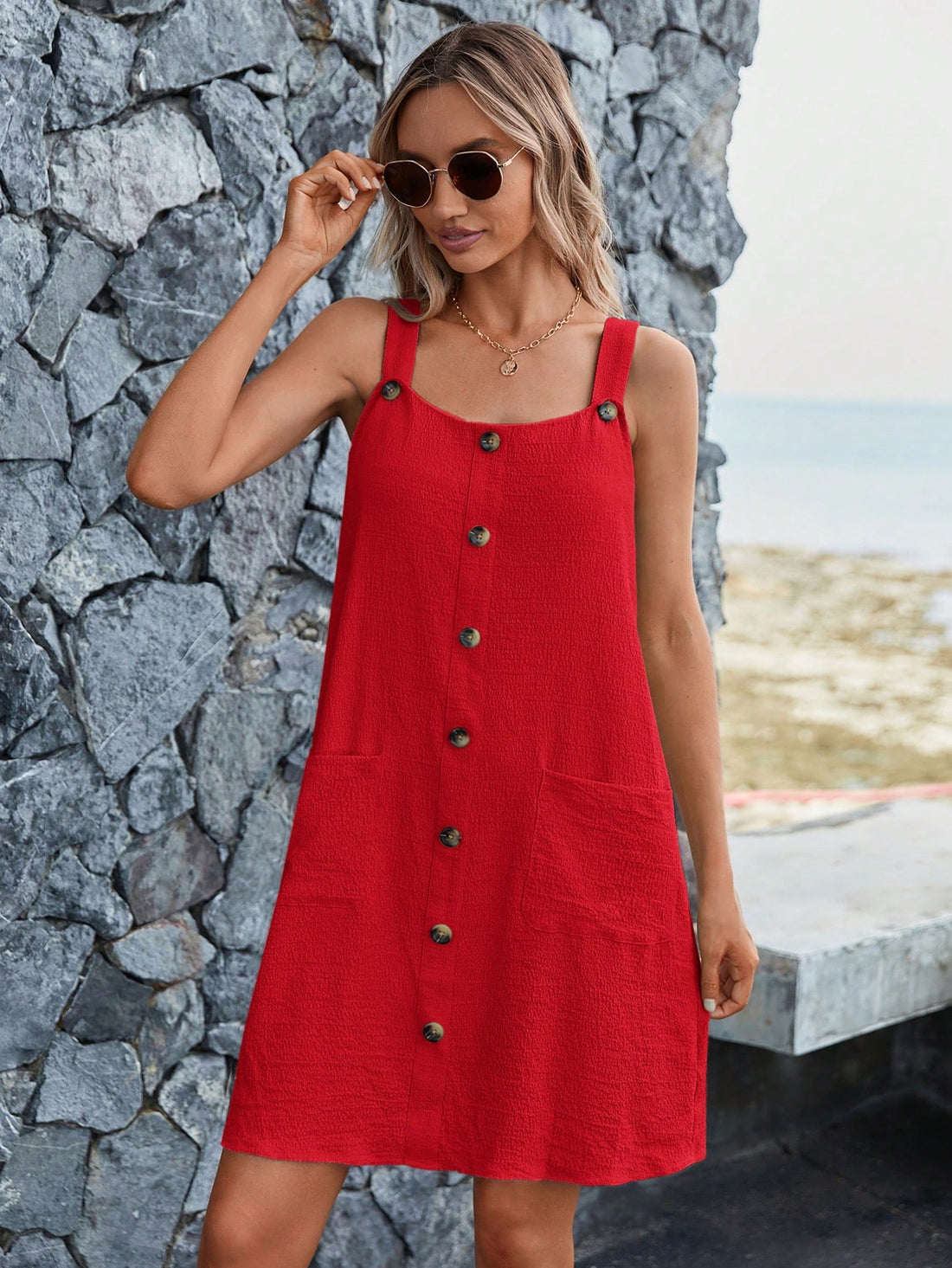 Stay stylishly comfortable in our Button-Front Pocket Patched Cami Dress! This effortlessly chic dress features a functional style with button-front pockets, perfect for carrying your essentials. Elevate your wardrobe and make a statement without sacrificing comfort.