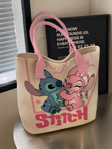 Cream Stitch tote bag with pink handles showing Stitch and Angel print with pink STITCH text