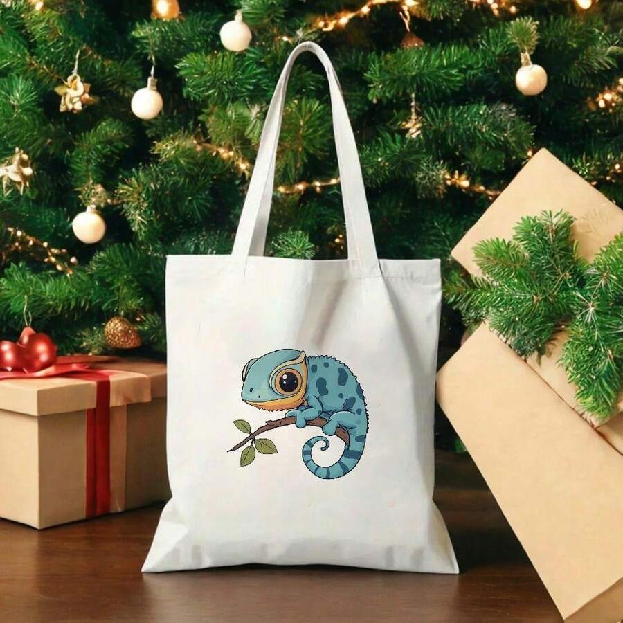 Front staged view of white canvas tote bag with blue chameleon branch print