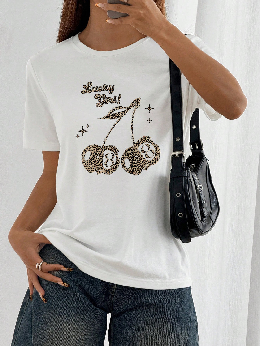 Get ready to be the envy of all your friends with this Casual Chic leopard print cherry graphic tee! The perfect mix of playful and stylish, this tee features a lucky cherry graphic that will have you feeling like a winner. Stand out from the crowd with this must-have addition to your wardrobe.