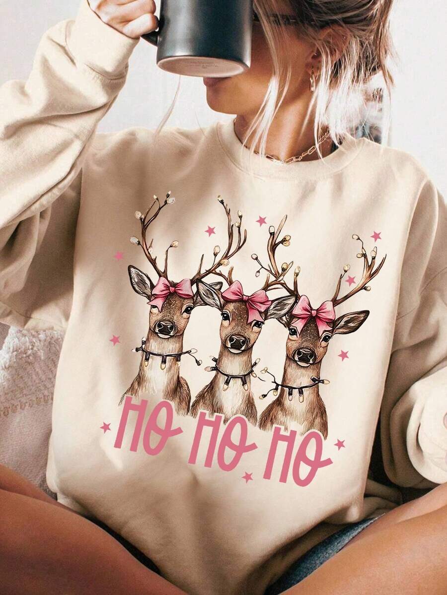Embrace the festive spirit with this charming reindeer print sweatshirt designed for cozy season comfort. Featuring a playful Christmas graphic that brings holiday cheer to your everyday wardrobe, this relaxed-fit piece is perfect for casual outings, holiday gatherings, or lazy days at home. Crafted for warmth and style, it pairs effortlessly with jeans, leggings, or joggers. Whether you're decorating, sipping hot cocoa, or spreading seasonal joy, this sweatshirt keeps you snug and merry from autumn through