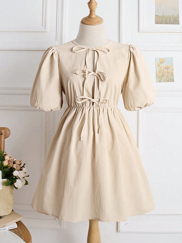 Add a little fun to your wardrobe with our Casual Puff Sleeve Mini Dress! Featuring a playful hollow-out bow tie detail and puff sleeves, this dress is perfect for spring and will have you looking effortlessly stylish. Say goodbye to boring outfits and hello to your new favorite dress!