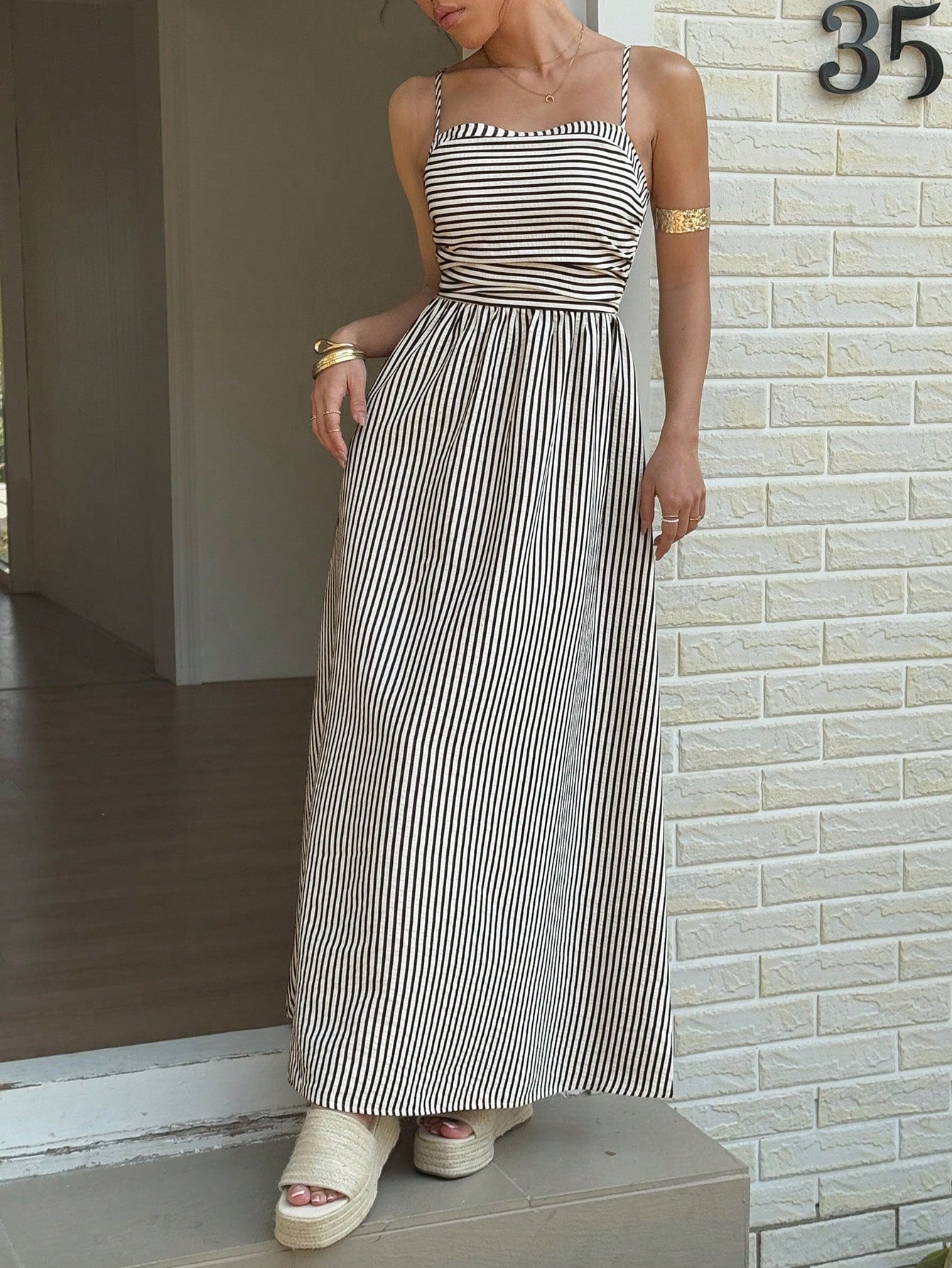 Effortlessly rock the summer with this Casual Striped Spaghetti Strap Maxi Dress. With its playful stripes and comfortable spaghetti straps, this dress is perfect for any casual occasion. Never sacrifice style for comfort again with this must-have piece for your summer wardrobe.