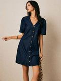 Step into summer with this playful V-neck denim midi dress, featuring charming puff sleeves that add a flirty touch. Its relaxed shift silhouette keeps you cool and comfortable all day long, while the classic blue denim brings effortless style to any casual outing. Perfect for sunny days and spontaneous adventures!
