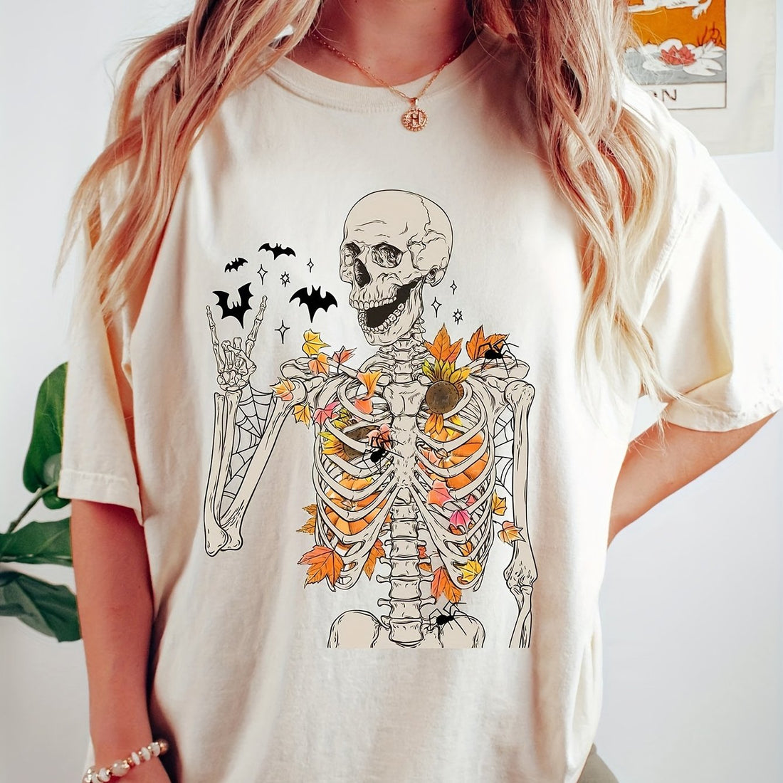 This Casual and Stylish Skeleton Floral Print Short Sleeve Tshirt for Women's Clothing is a must-have for fashion-forward individuals. Made with comfortable materials, the unique skeleton and floral print adds a touch of edginess to any outfit. Perfect for casual outings or dressed up with accessories for a stylish look.