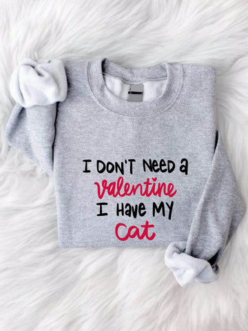 Show off your love for your feline friend this Valentine's Day with our Cat Lover Sweatshirt! Featuring the slogan "I Don't Need A Valentine I Have My Cat", this sweatshirt is perfect for those who don't take themselves too seriously. Stay cozy and stylish while expressing your quirky personality.