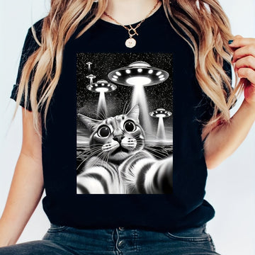 This Cats and UFO Printed T-Shirt is the perfect addition to any women's clothing collection. With a casual short sleeve design and comfortable crew neck, this t-shirt is both stylish and comfortable. The unique print featuring cats and UFOs adds a fun and playful touch to any outfit. Crafted with high-quality materials, this t-shirt is sure to become a wardrobe staple.