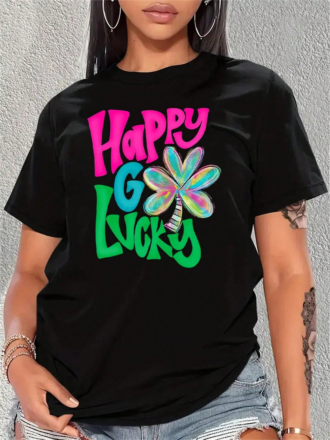 Get ready to shamrock and roll with this festive tee! Perfect for St. Patrick's Day, this fun and playful graphic tee features a cheerful leprechaun holding a vibrant shamrock. Bring a touch of Irish luck and style to your celebration with this must-have tee.