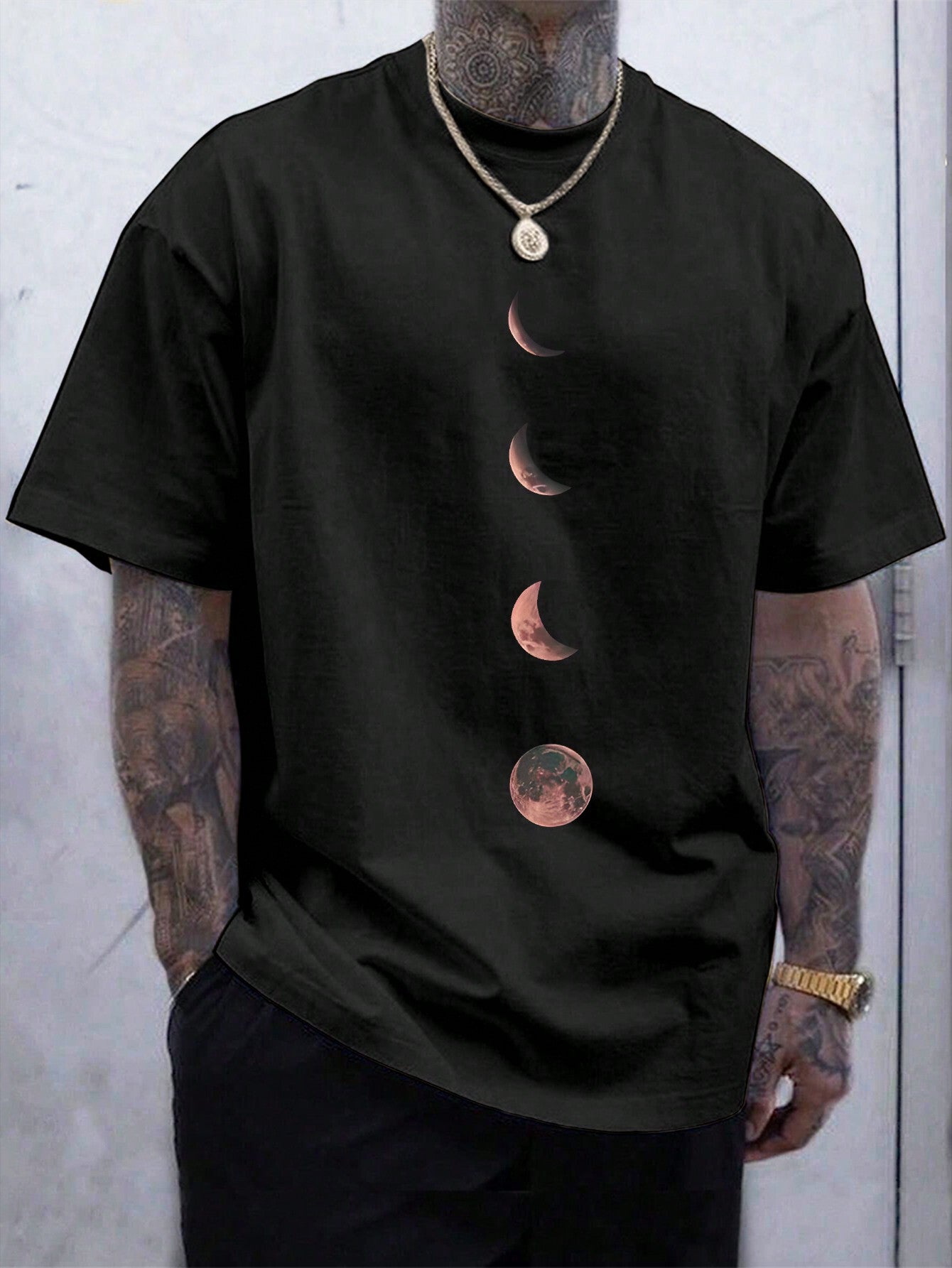Add a touch of celestial style to your wardrobe with this Moon Pattern T-Shirt. Featuring a comfortable round neck and short sleeves, this quirky shirt is perfect for astronomy enthusiasts and fashion-forward individuals alike. Embrace the moon's energy and show off your unique sense of style with this one-of-a-kind shirt.