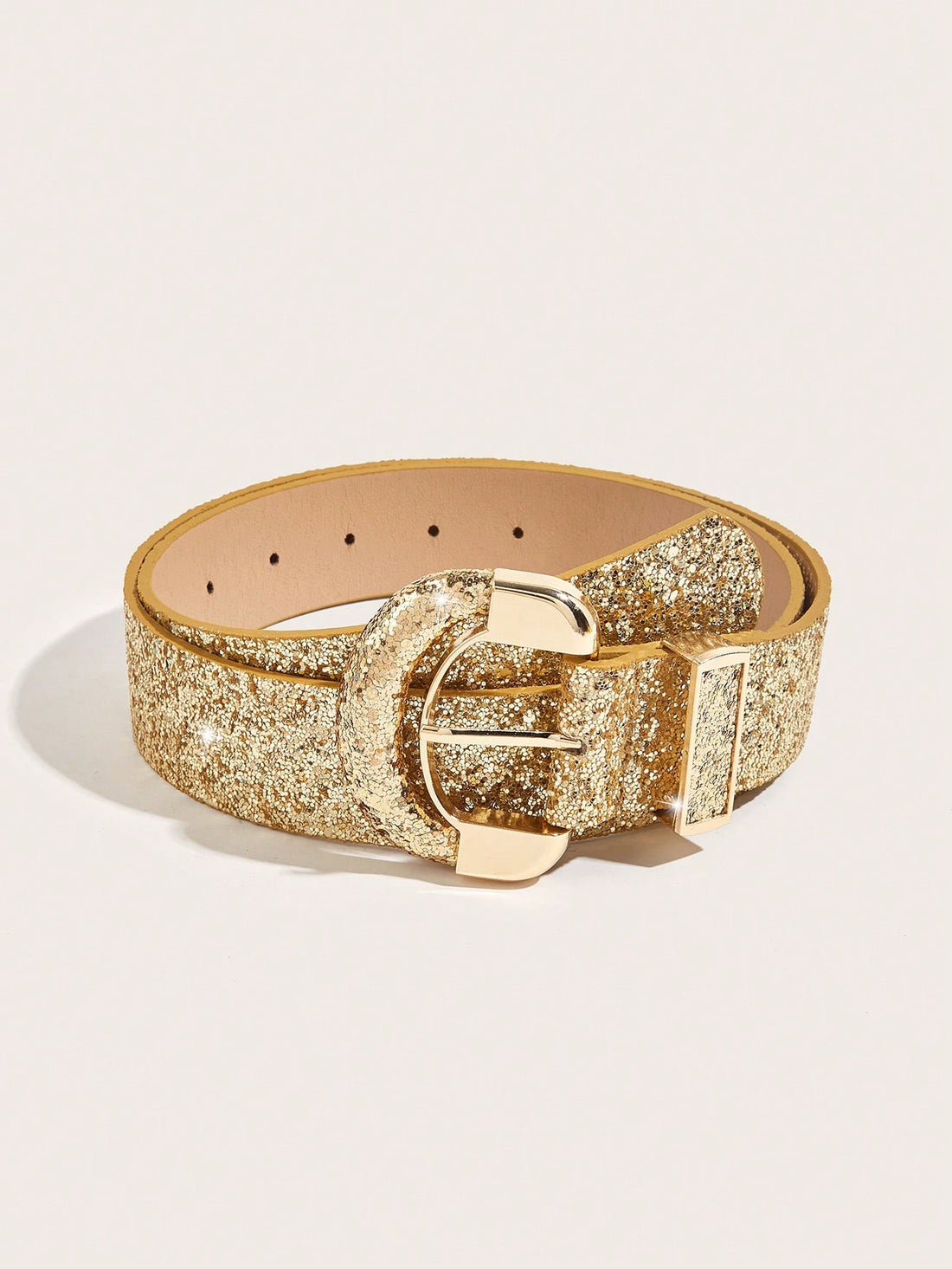 The Champagne Glitter Alloy PU Belt is the perfect accessory for festivals, parties, and weddings. Made with a glittering champagne color and durable alloy and PU materials, this belt adds just the right amount of sparkle to any outfit. Elevate your style and stand out from the crowd with this must-have fashion accessory.